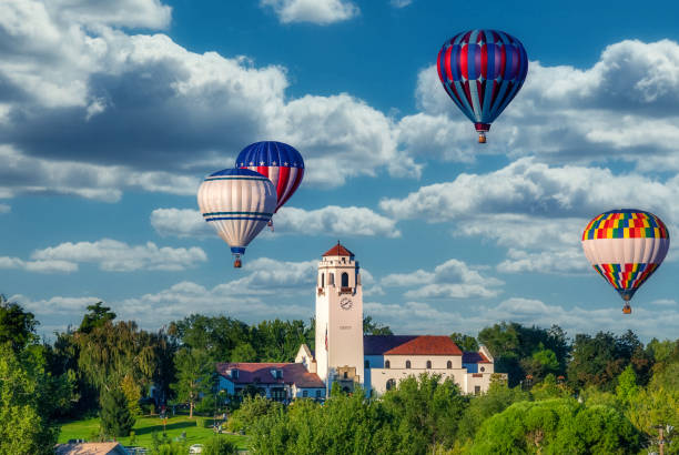 Clock tower of a local train depot with Hot Air Balloons